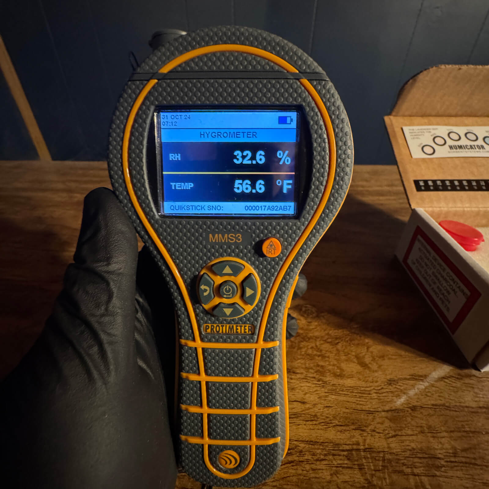 Hygrometer reading showing indoor humidity and temperature analysis by Vert Environmental.