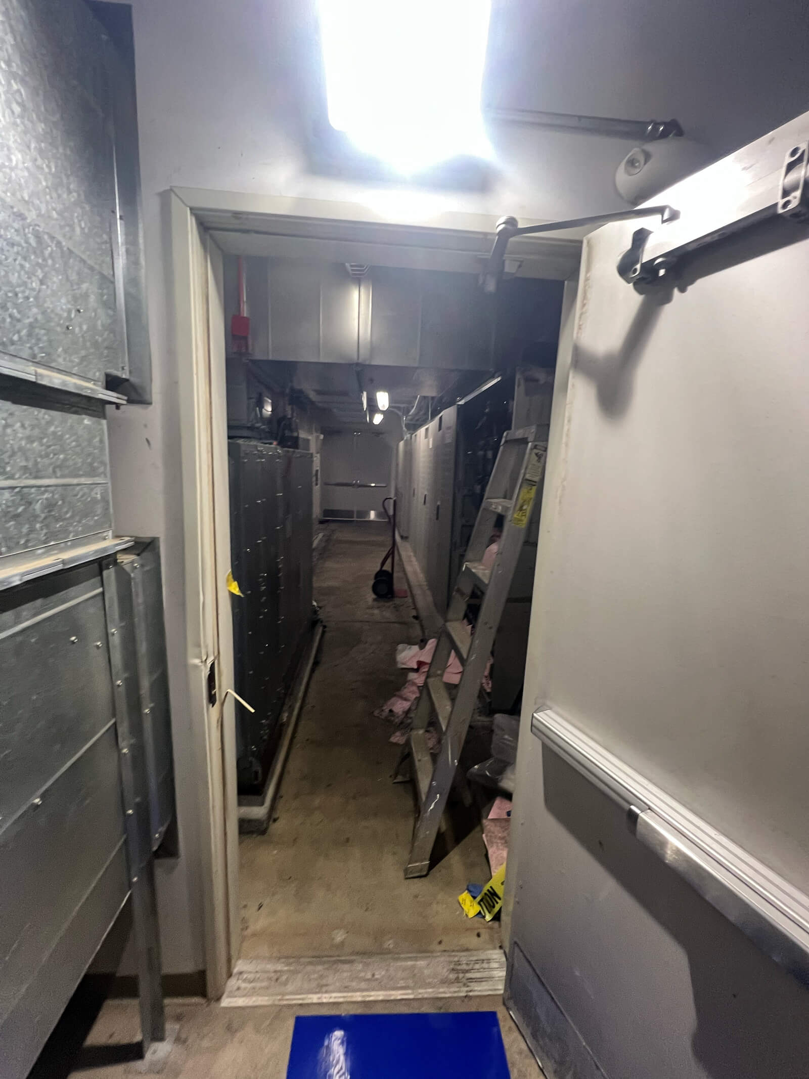Professional inspection of an industrial lithium battery storage system.