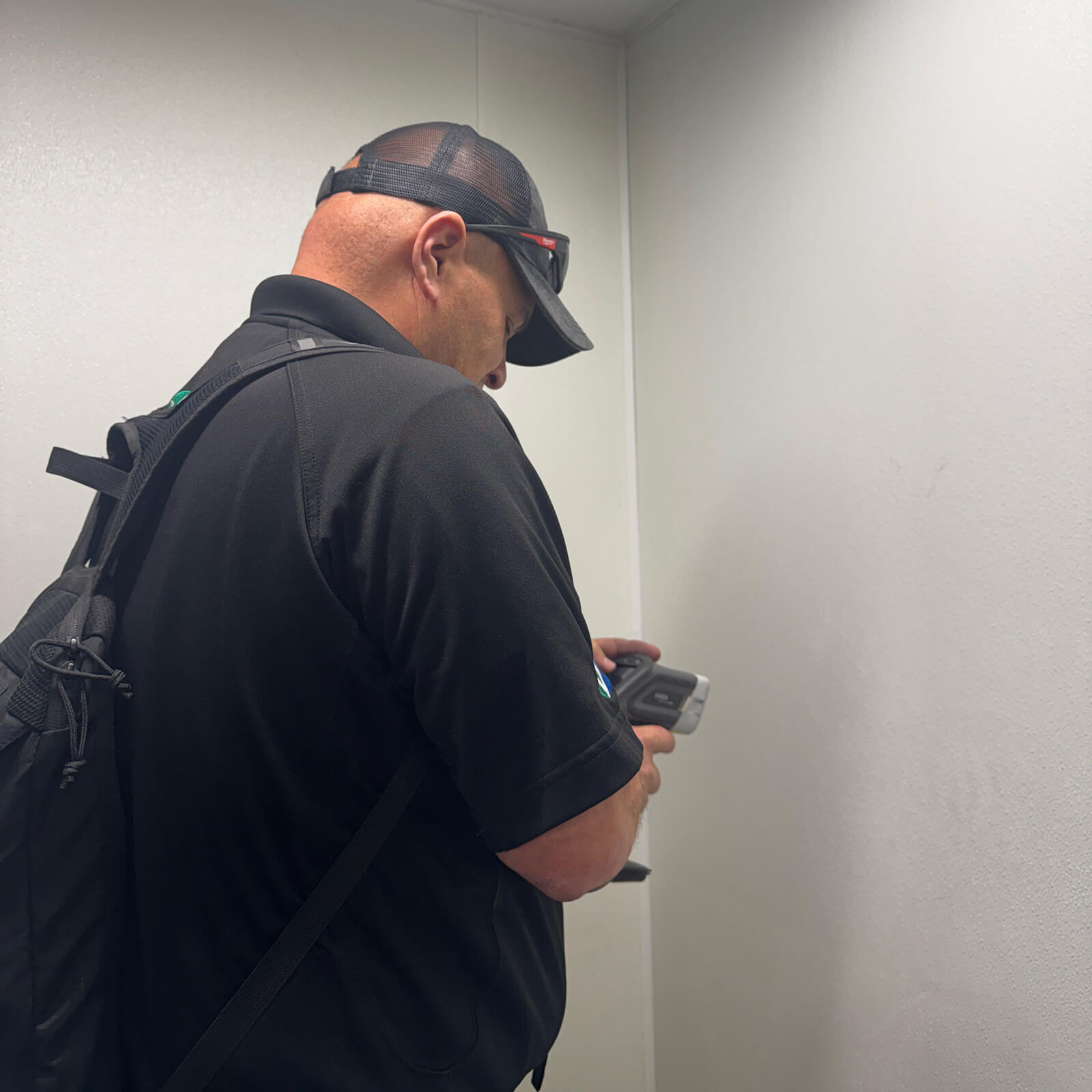 Vert Environmental technician conducting a lead hazard assessment using an XRF analyzer.
